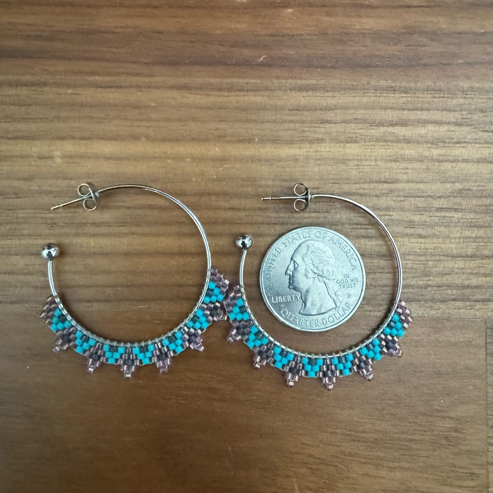 Silver hoop earrings with beaded design